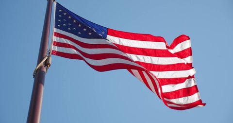 American Flag Slow Waving with visible wrinkles.Close up of UNITED STATES flag. USA,