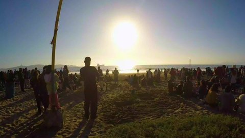 LA SERENA, CHILE - July 2, 2019: This is a 4K time lapse of people on the beach in La Serena, Chile watching the total solar eclipse.