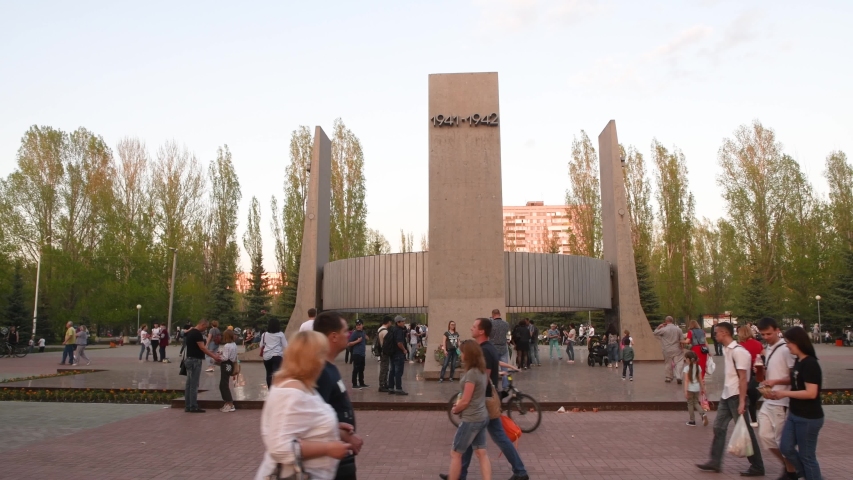 Togliatti / Russia - 9 May 2019: People walking in the central park along war memorial celebrating the anniversary of Victory day