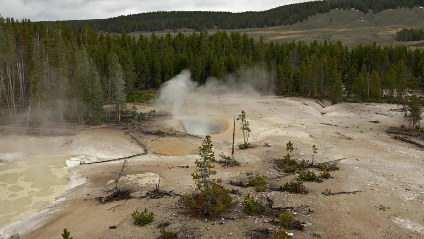 Yellowstone national park footage of various geysers and waterfalls 