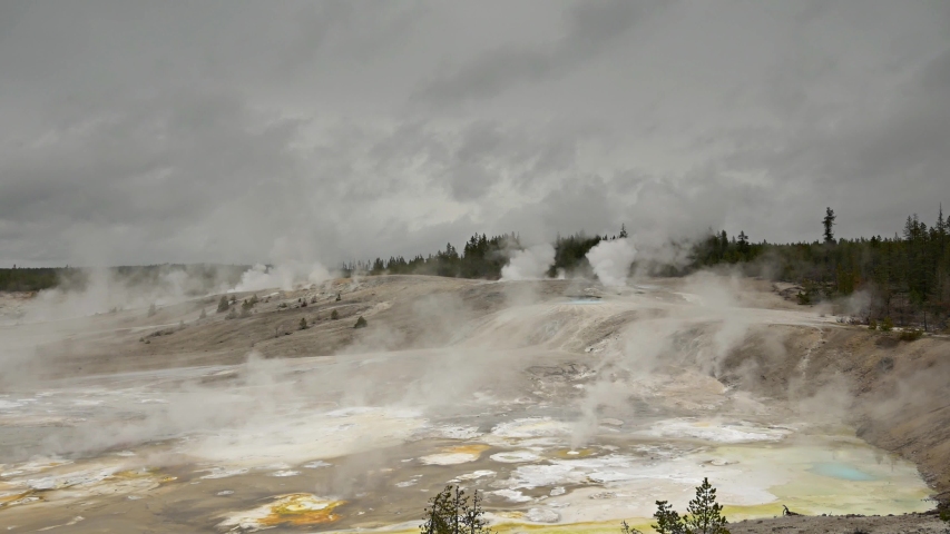 Yellowstone national park footage of various geysers and waterfalls 