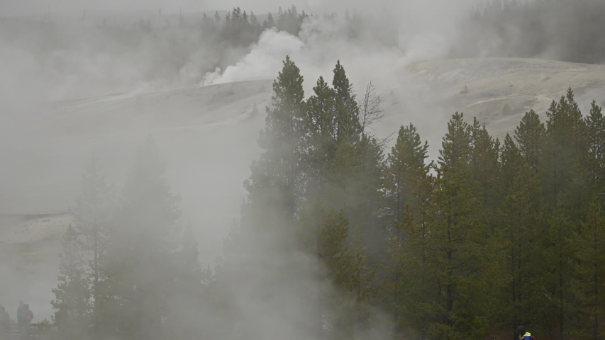 Yellowstone national park footage of various geysers and waterfalls 