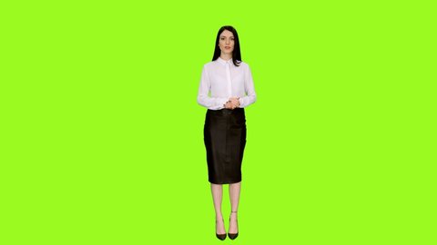 Young charming brunette woman doing presentation and gesturing on green screen background, Chroma key, Front view, 4k shot