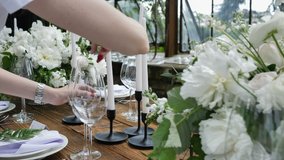 Decorating a Festive table. Wedding Table Decoration with Bouquets of Natural Fresh Flowers for a Family Feast - Powered by Shutterstock - Get 15% off with code: PIKWIZARD15