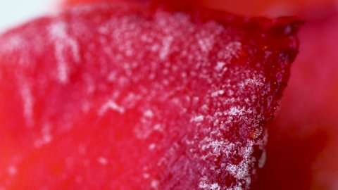 juicy strawberries of red color, covered with hoarfrost, snow. close-up