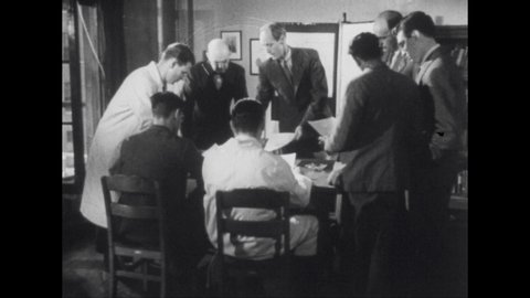 1950s: Men gathered around table look at blueprints. Kids in library, girl points at sign. Sign warns of diphtheria. Woman stands at house door, door opens and woman hands woman piece of paper.
