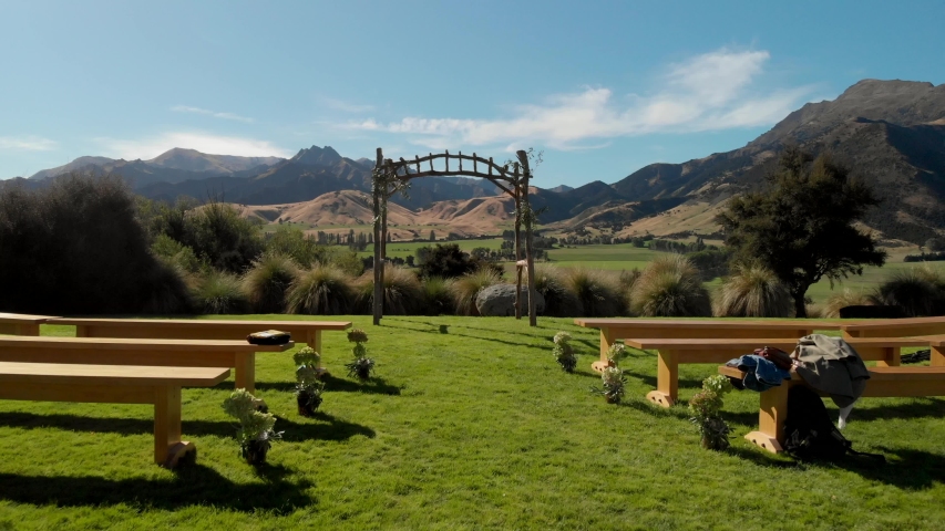 Exterior Wedding Ceremony Field and Amazing Countryside Landscape in Central Otago, New Zealand. Aerial Pull Up