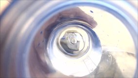 Slow motion first person view video shot of a person drinking water from a water bottle