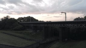 Sunrise cloudscape aerial, rising over British archway railway bridge & farmland. - Powered by Shutterstock - Get 15% off with code: PIKWIZARD15