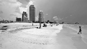 Miami Beach, FL USA - June 10, 2015: High definition black and white panning video of Miami Beach with visitors enjoying the beach.