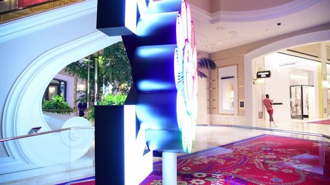 Las Vegas, NV: July 13, 2019:  Arrows and Flower Neon Sign by Takashi Murakami and Virgin Abloh at the Wynn Plaza in Las Vegas, NV.  Wynn Plaza is owned by Wynn Las Vegas.  