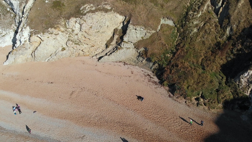 Version One. Aerial Tilt Up Reveal of Durdle Door, drone flying backward.
