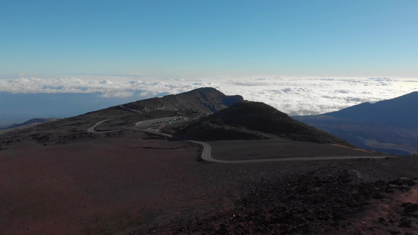 Aerial Tilt Down Shot over Haleakala National Park flying into Volcano Crater.