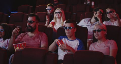 young people watch movies cinema horror Stock Footage Video (100%