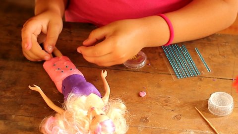 Tampa, Florida / USA - July 19 2018: Play And Story Young Girl Playing With Barbie Dolls Figurines