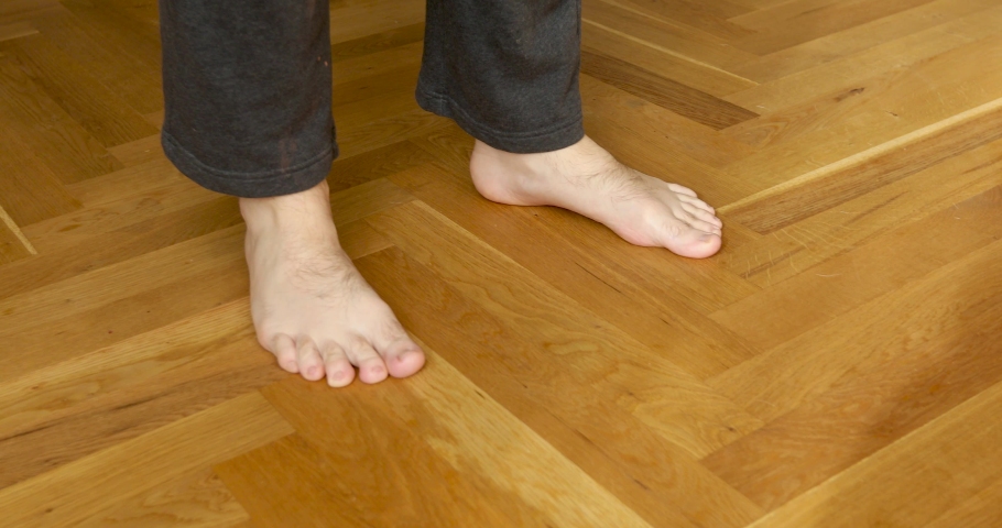 Crop Feet Of Man Stock Footage, Barefoot Hardwood Flooring