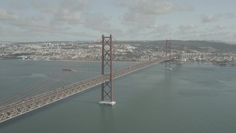 25 April bridge in Lisbon, Portugal, at sunny day, 4k aerial ungraded / raw