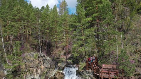 ALTAI, RUSSIA - MAY 17, 2019: Aerial video from drone with view down on Kamyshlinsky Waterfall. Waterfall located at the mouth of the river Kamyshla in Shebalinsky District of Altai Republic, Russia