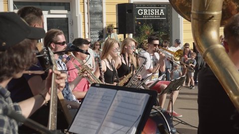 Omsk, Russia - July 13, 2019: The brass band musicians perform in busy city street.