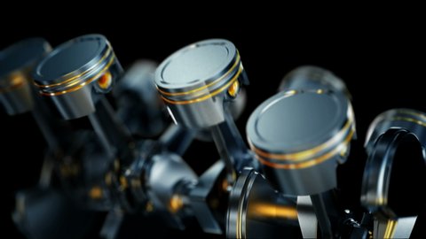 A close-up of engine in slow motion, pistons and valves.