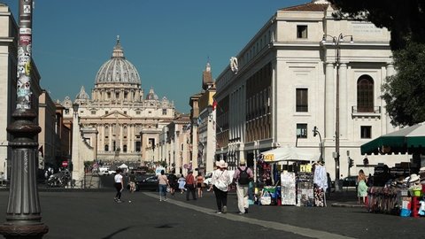 Rome, JULY 03, 2019: Tourists walk along the Via della Conciliazione, with San Pietro in the background. time lapse effect