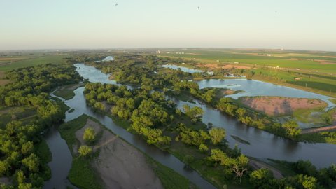 flying over shallow and braided South Platte River in Nebraska at Brule with freeway in a distance