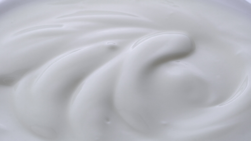 Closeup shot of mixing yogurt, Rotating
 | Shutterstock HD Video #1033590809