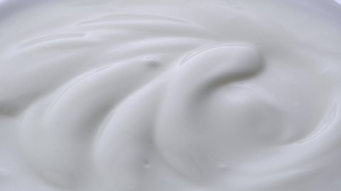 Closeup shot of mixing yogurt, Rotating
