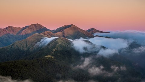 Colorful sunrise over mystic alpine mountains in New Zealand wild nature Time lapse