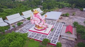 Aerial video of Pink Statue of Ganesha the Elephant Hindu Deity in Nakhon Nayok province, Thailand