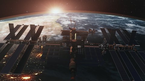 Modern International Space Station over planet Earth covered with white clouds hiding Sun. 3d animation. Science and technology concept. 4K. Elements of this media furnished by NASA