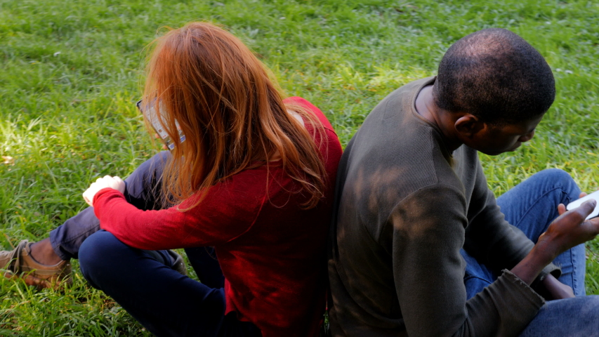 youth, technology, incommunicability.Interracial friends using smartphones