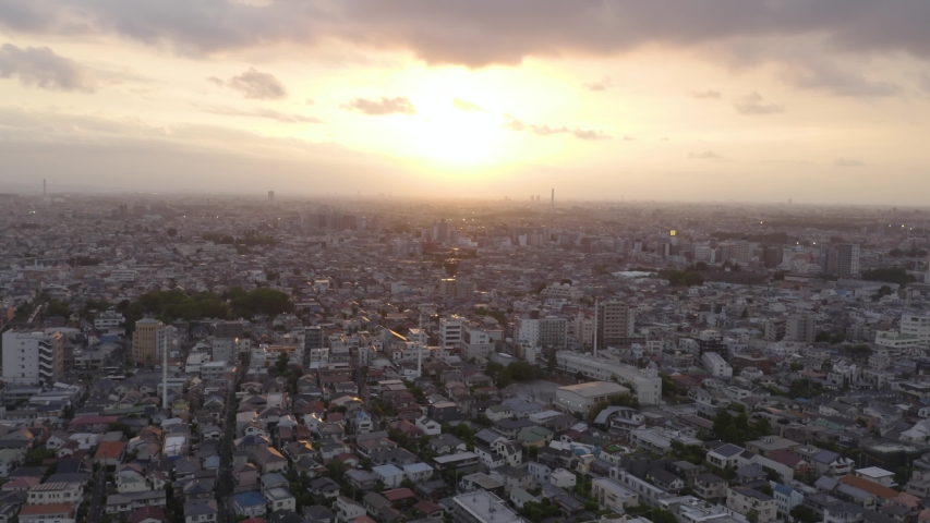 Aerial shot of Tokyo city during sunset, concrete jungle all over the horizon