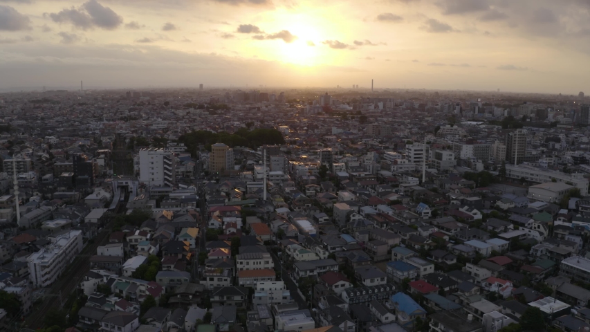 Aerial shot of Tokyo city during sunset, concrete jungle all over the horizon
