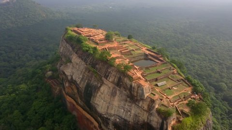Rotating aerial shot of Sigiriya Rock, Sri Lanka close