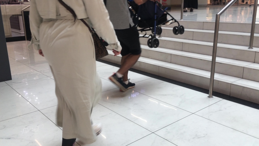People entering in shopping mall from the main entrance
