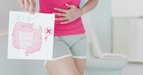 asian woman feel pain with constipation and hold intestine cartoon billboard in wc