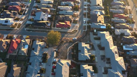 Aerial footage of streets and housing on a late afternoon sunny day in Canberra, Australia    