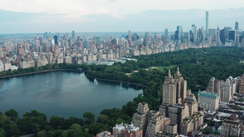 New York City, NY/USA - 07.09.2019: View on Central Park, buildings and skyscrapers from air. Aerial cityscape view of Manhattan from a drone. 