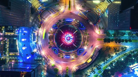 Aerial view Time lapse of the Fountain and Traffic in the Circle at night at Singapore