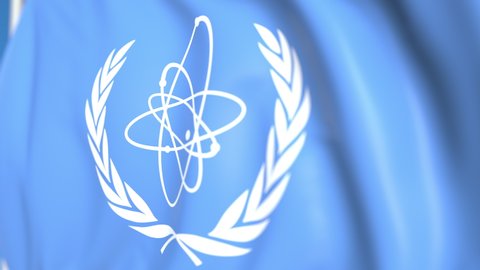 Waving national flag of the International Atomic Energy Agency IAEA close-up, editorial loopable 3D animation