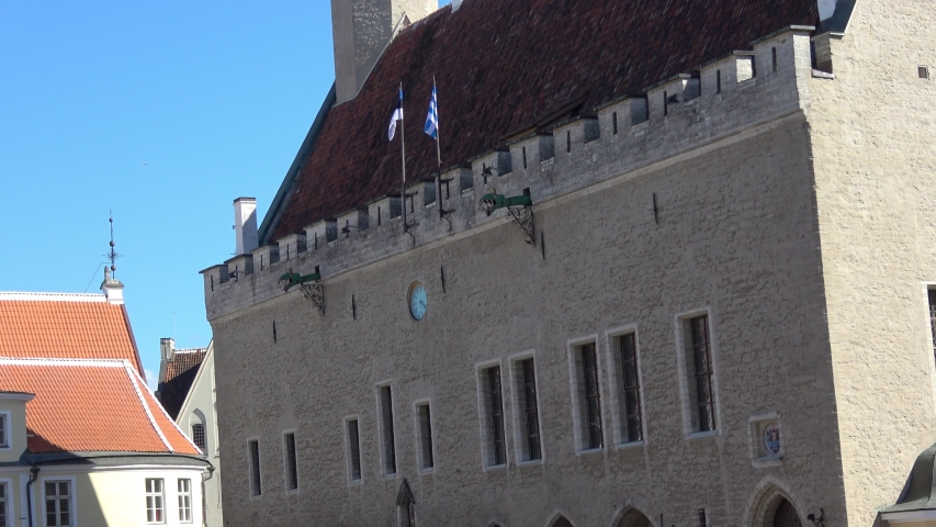 Tallinn, Estonia, June 9, 2019. View of Town Hall with Old Thomas - mini figure on the pole, the symbol of the city.