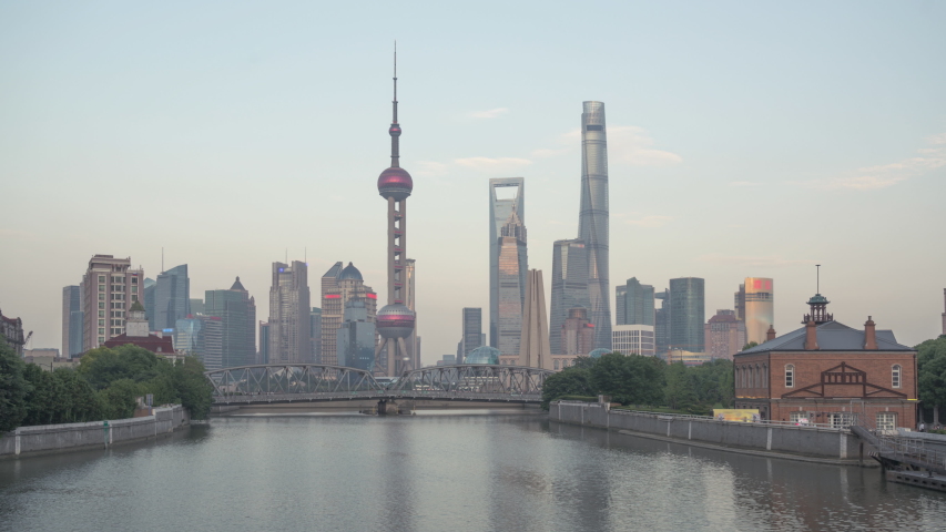 time lapse of sunset, Shanghai skyline and Waibaidu bridge, China Royalty-Free Stock Footage #1033677962