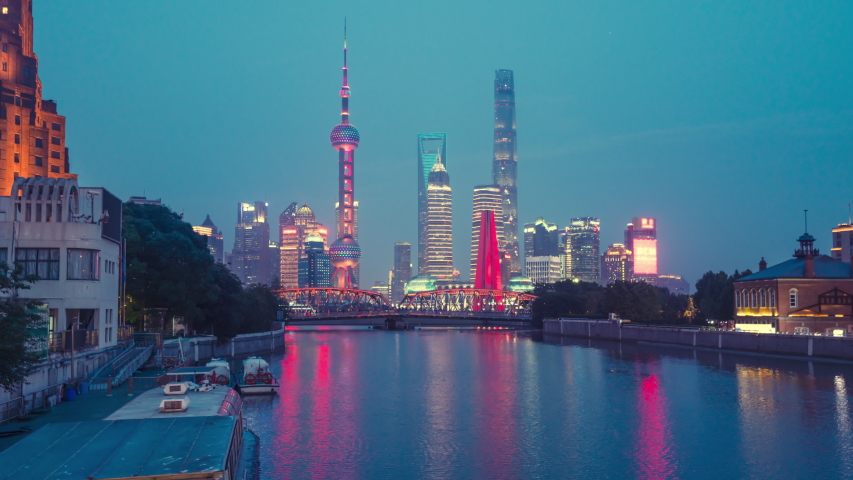 time lapse of sunset, Shanghai skyline and Waibaidu bridge, China Royalty-Free Stock Footage #1033677965