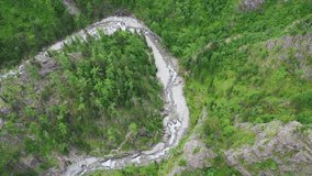 Overview of the beautiful landscape. Flying drone over a mountain river . Bird's eye view