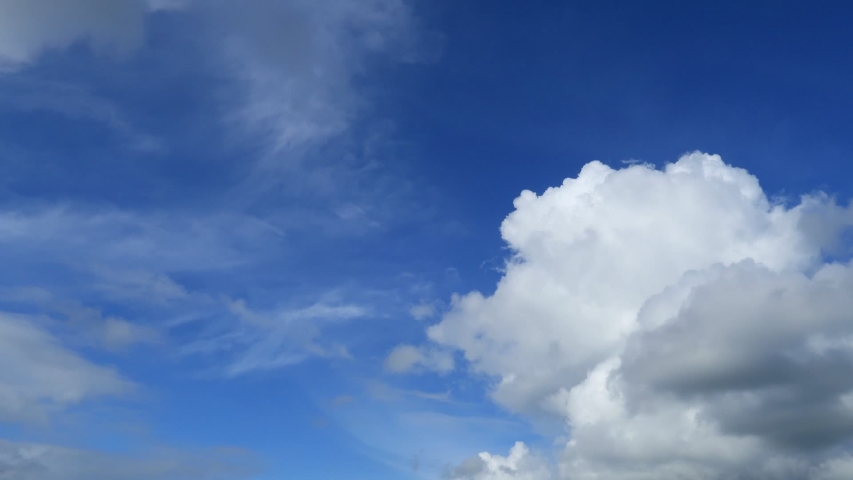 Day to night TimeLapse of white puffy & fluffy clouds on blue sky in tropical summer sunny & sunshine day changing & turning to scary gray & dark cloudscape in night skyline, space horizon Time Lapse Royalty-Free Stock Footage #1033709162