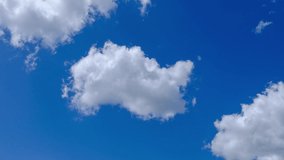 Sunny blue sky and moving white clouds. Beautiful cloud flying in blue sky, timelapse video. 
