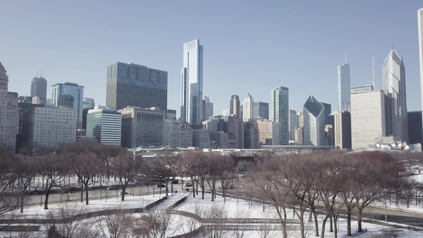 Aerial winter shot from Millenium park in Chicago with Skycrapers - Colored Shot Royalty-Free Stock Footage #1033725620