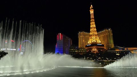 Las Vegas, NV - CIRCA MARCH 2015 - Bellagio Fountain and Paris hotel, Night illumination on Las Vegas Strip, Nevada, circa March 2015