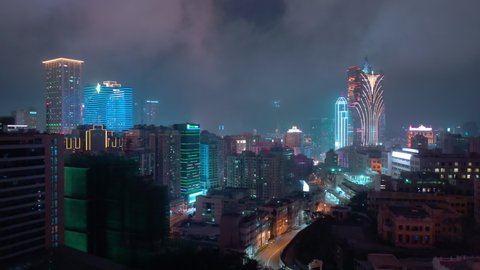 MACAU, CHINA - FEBRUARY 10 2019: night time illumination flight over macau city famous hotel area aerial panorama 4k circa february 10 2019 macau, china.